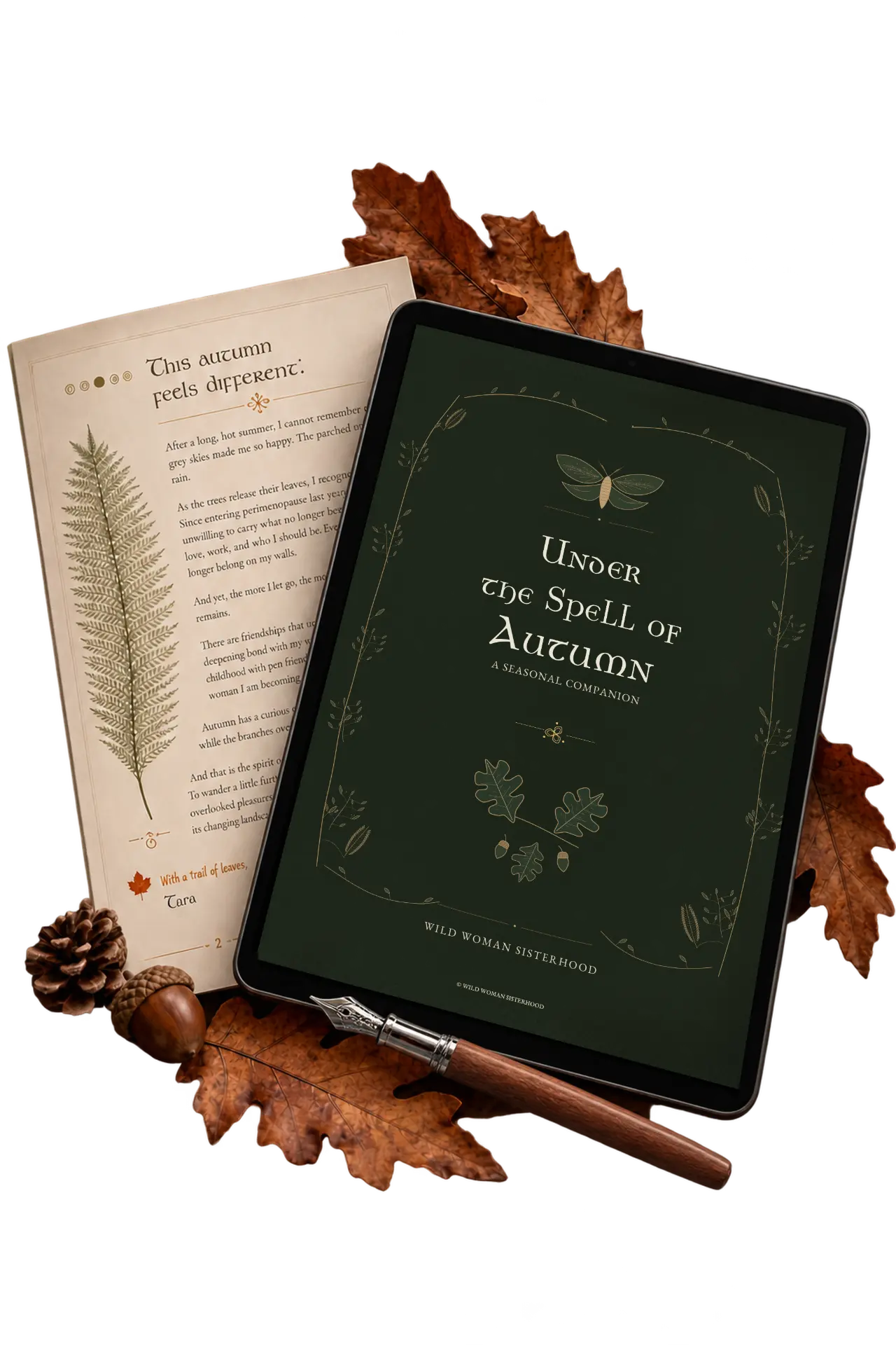 Under the Spell of Autumn, the free seasonal guide from Wild Woman Sisterhood, on a tablet beside a printed page, oak leaves and a fountain pen